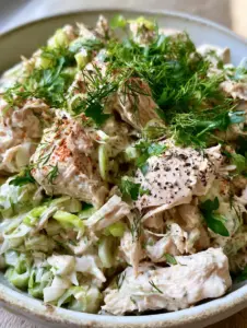 Macro photo of savory chicken salad showing the velvety dressing and neon-green celery. (savory chicken salad)